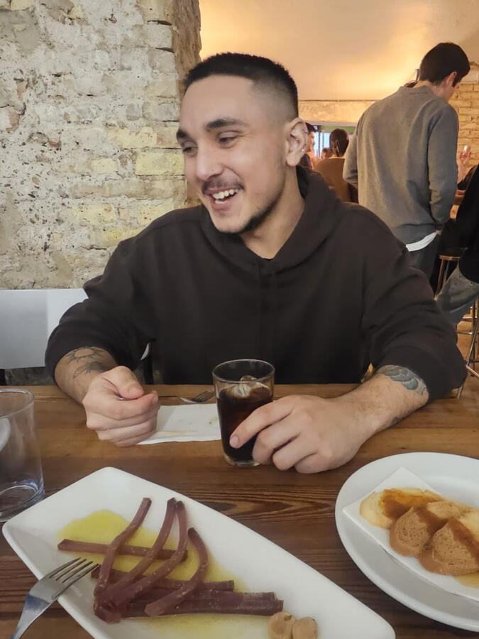 Evan experiencing the culinary scene of Spain.
